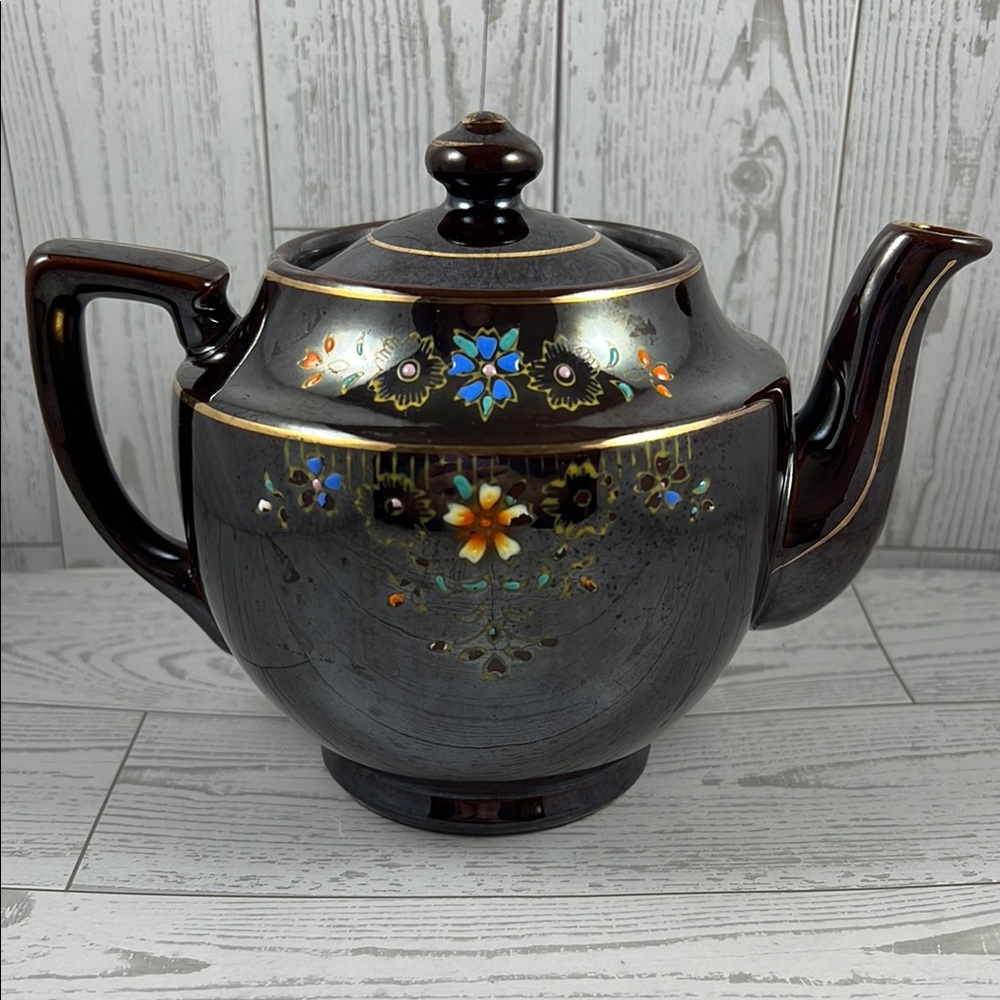 Elegant Brown Teapot with Floral Design